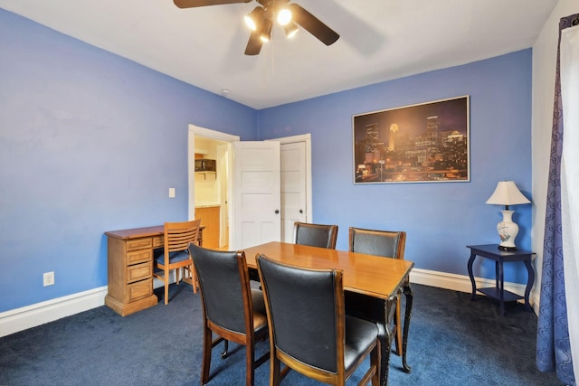 carpeted dining area with ceiling fan