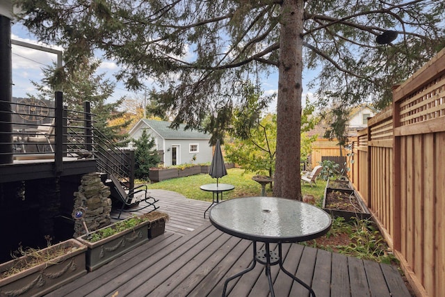 wooden terrace with a yard