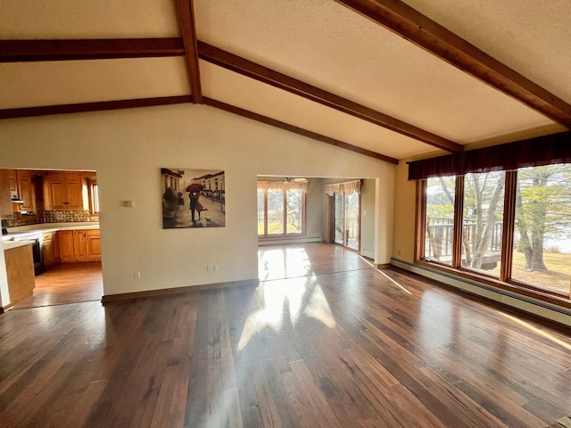 unfurnished living room with lofted ceiling with beams, light wood finished floors, and baseboards