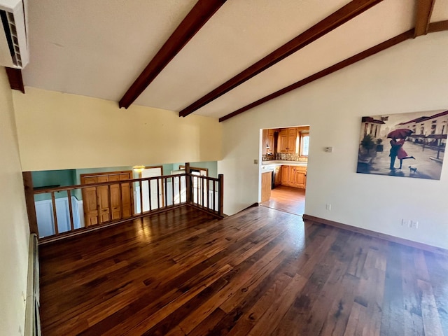 spare room featuring a baseboard radiator, dark wood finished floors, lofted ceiling with beams, and baseboards