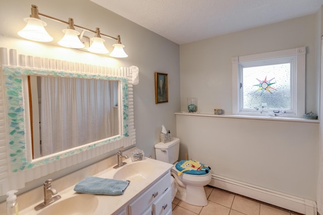 full bath featuring tile patterned flooring, a baseboard radiator, a sink, and toilet