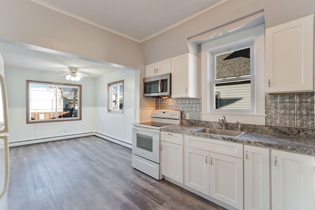 kitchen featuring tasteful backsplash, white electric range oven, crown molding, sink, and white cabinetry