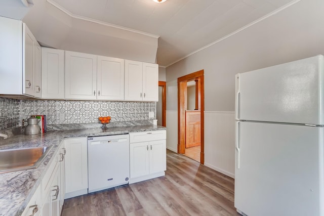 kitchen featuring white cabinetry, sink, white appliances, and ornamental molding