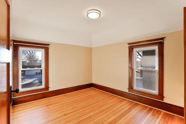 unfurnished room featuring hardwood / wood-style flooring