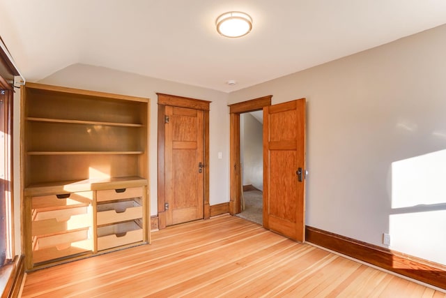 unfurnished bedroom with wood-type flooring