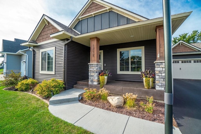 craftsman inspired home featuring a porch and a garage