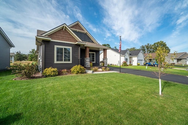 craftsman-style house with a front yard