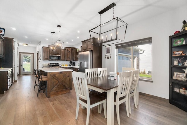 dining area with light hardwood / wood-style floors