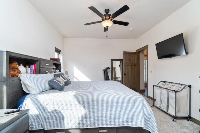 bedroom featuring ceiling fan and light carpet