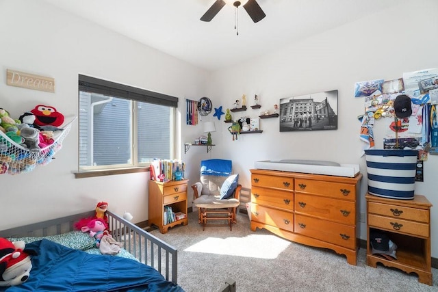 carpeted bedroom with ceiling fan