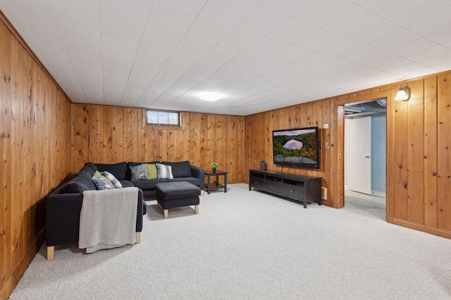 living room featuring wooden walls and carpet