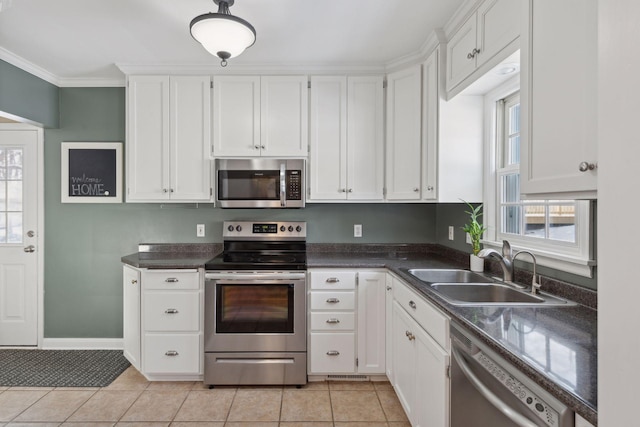 kitchen featuring white cabinetry, stainless steel appliances, and sink