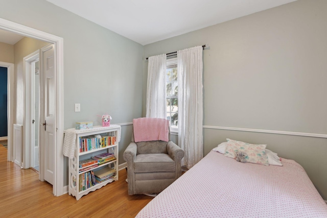 bedroom with wood-type flooring