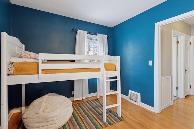 bedroom with wood-type flooring