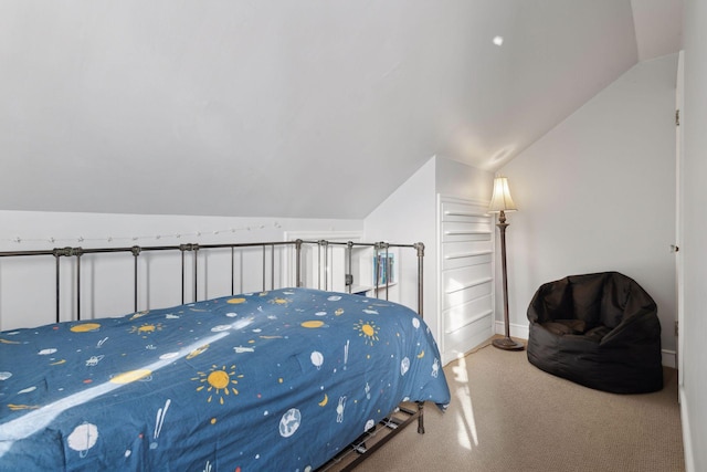 bedroom featuring carpet flooring and vaulted ceiling