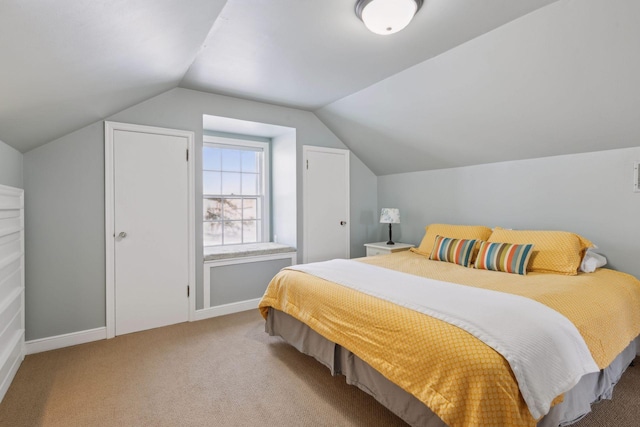 bedroom featuring light carpet and lofted ceiling