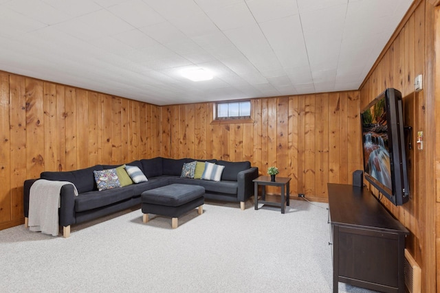 living room with carpet and wooden walls