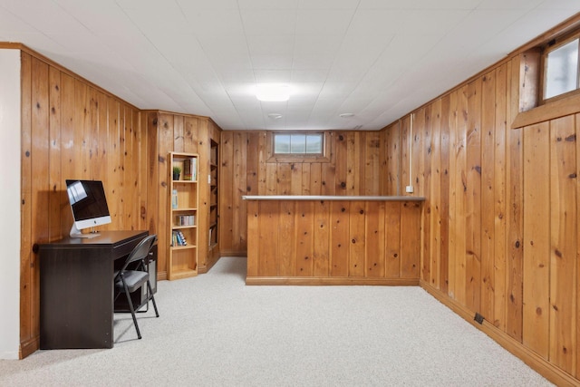 carpeted office with wood walls