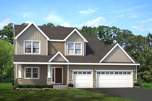 craftsman inspired home with a garage and a front lawn