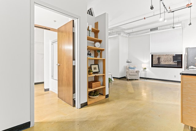 corridor featuring concrete floors