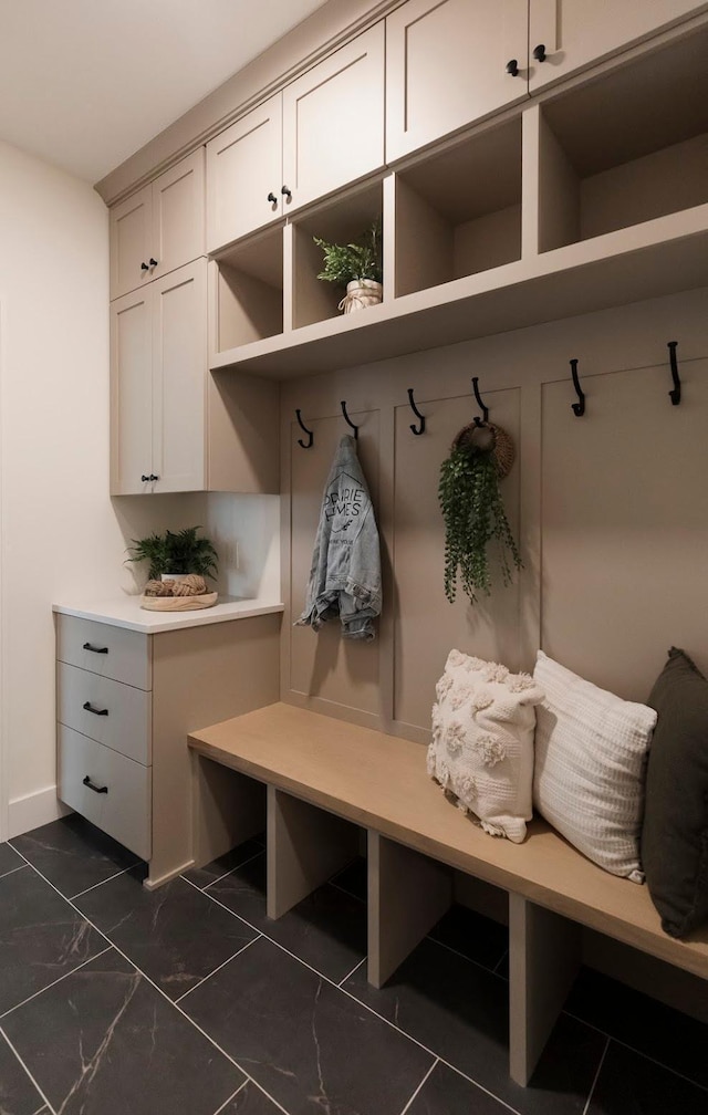mudroom featuring marble finish floor