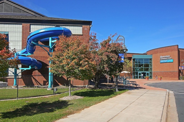view of building exterior with fence