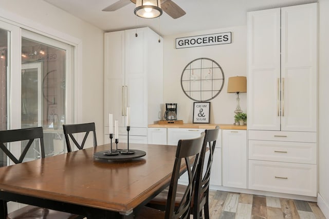 dining area featuring ceiling fan and light hardwood / wood-style flooring