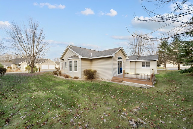 exterior space with a wooden deck and a front yard