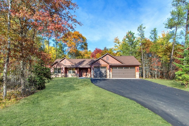 view of front facade featuring a front yard and a garage