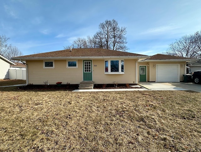 single story home featuring a front lawn and a garage