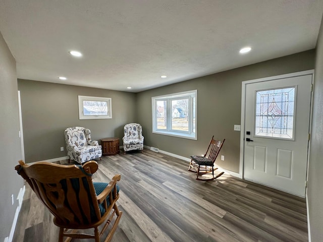 912 Oakley St, Luverne, MN 56156 - living area featuring hardwood / wood-style flooring and a textured ceiling