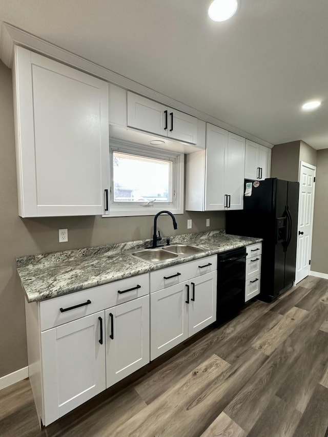 912 Oakley St, Luverne, MN 56156 - kitchen with white cabinetry, dark wood-type flooring, sink, and black appliances