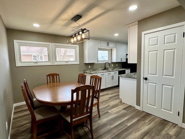 912 Oakley St, Luverne, MN 56156 - dining area featuring wood-type flooring and sink