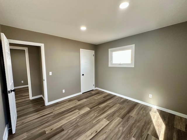912 Oakley St, Luverne, MN 56156 - unfurnished bedroom featuring dark hardwood / wood-style floors