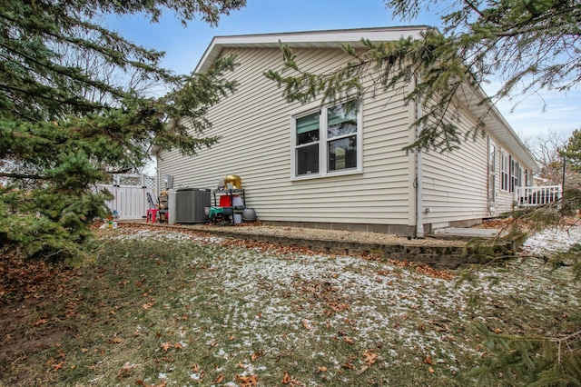 view of property exterior with central AC unit