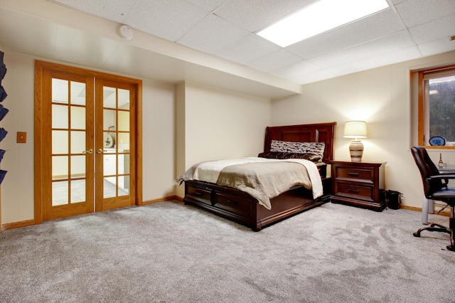 carpeted bedroom with french doors