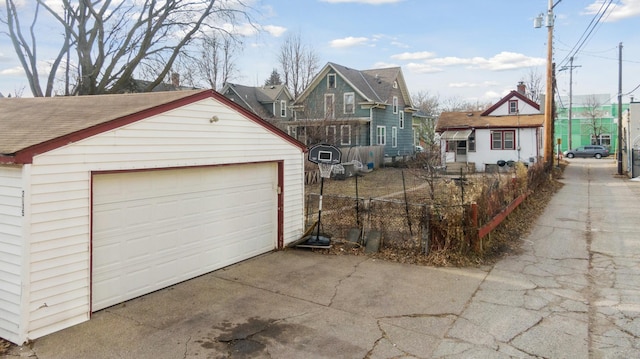 view of front facade featuring a garage and an outdoor structure