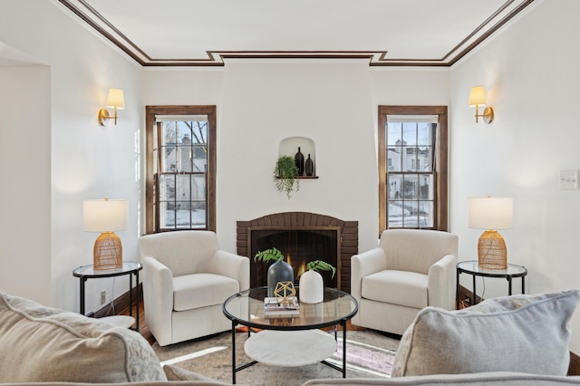 living room featuring crown molding and a fireplace