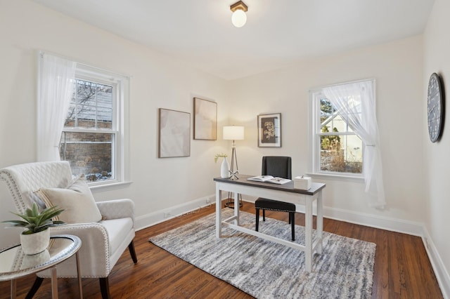 office with dark hardwood / wood-style flooring