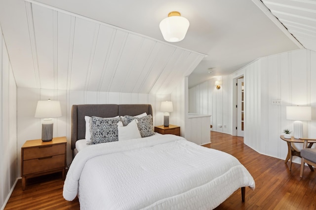 bedroom with dark hardwood / wood-style flooring