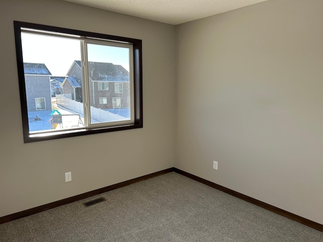 unfurnished room featuring carpet flooring