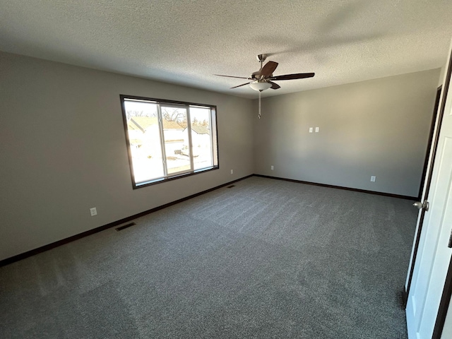 unfurnished room with a textured ceiling, ceiling fan, and carpet floors