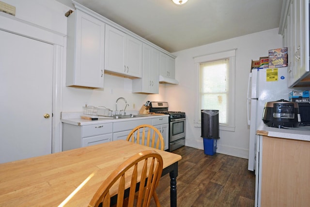 kitchen featuring white cabinets, dark hardwood / wood-style floors, sink, and stainless steel range with gas stovetop