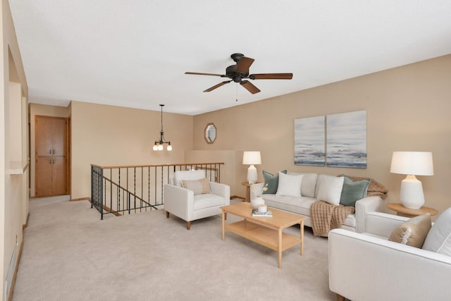 living room with light carpet and ceiling fan with notable chandelier