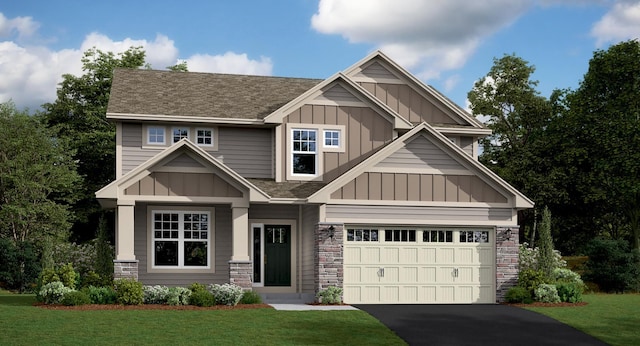 craftsman-style home featuring a front yard and a garage