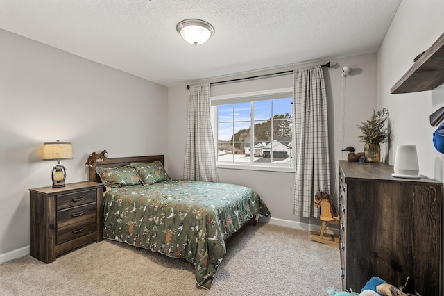 carpeted bedroom featuring a textured ceiling