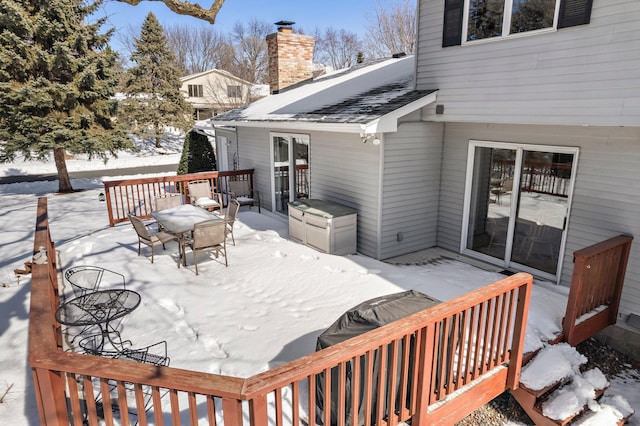 view of snow covered deck