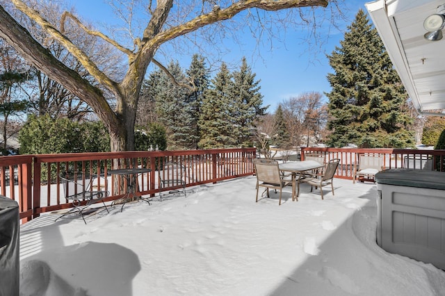 wooden deck featuring outdoor dining area