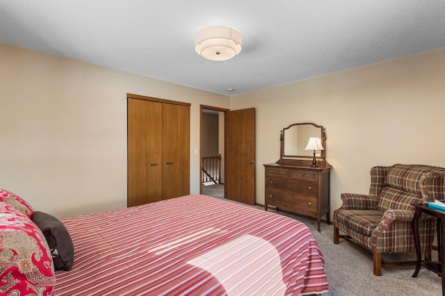 carpeted bedroom with a closet