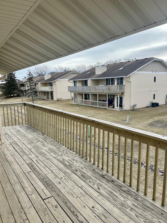 wooden deck with central air condition unit